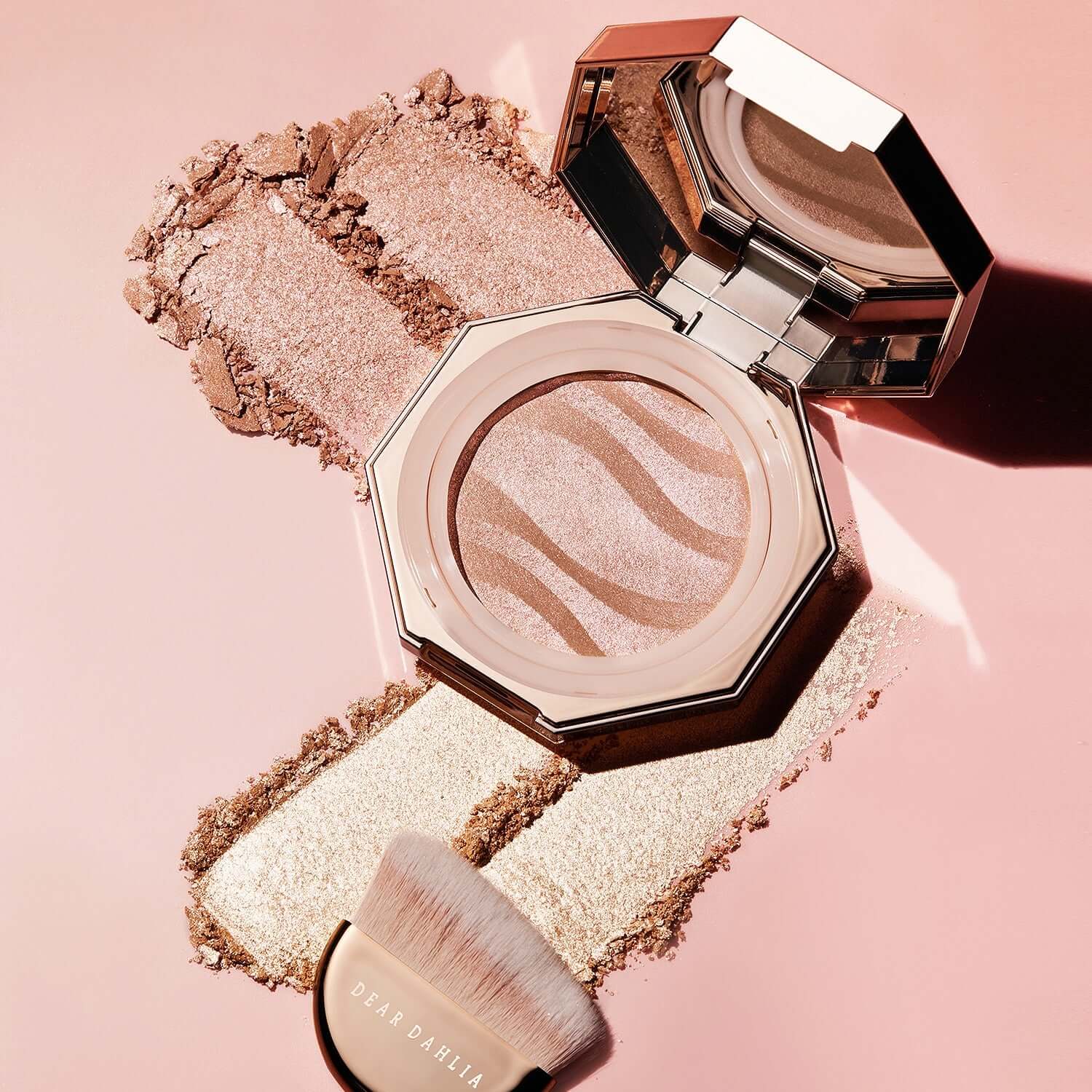 DEAR DAHLIA Blooming Edition Endless Glow Illuminator with brush on pink background showing shimmering texture