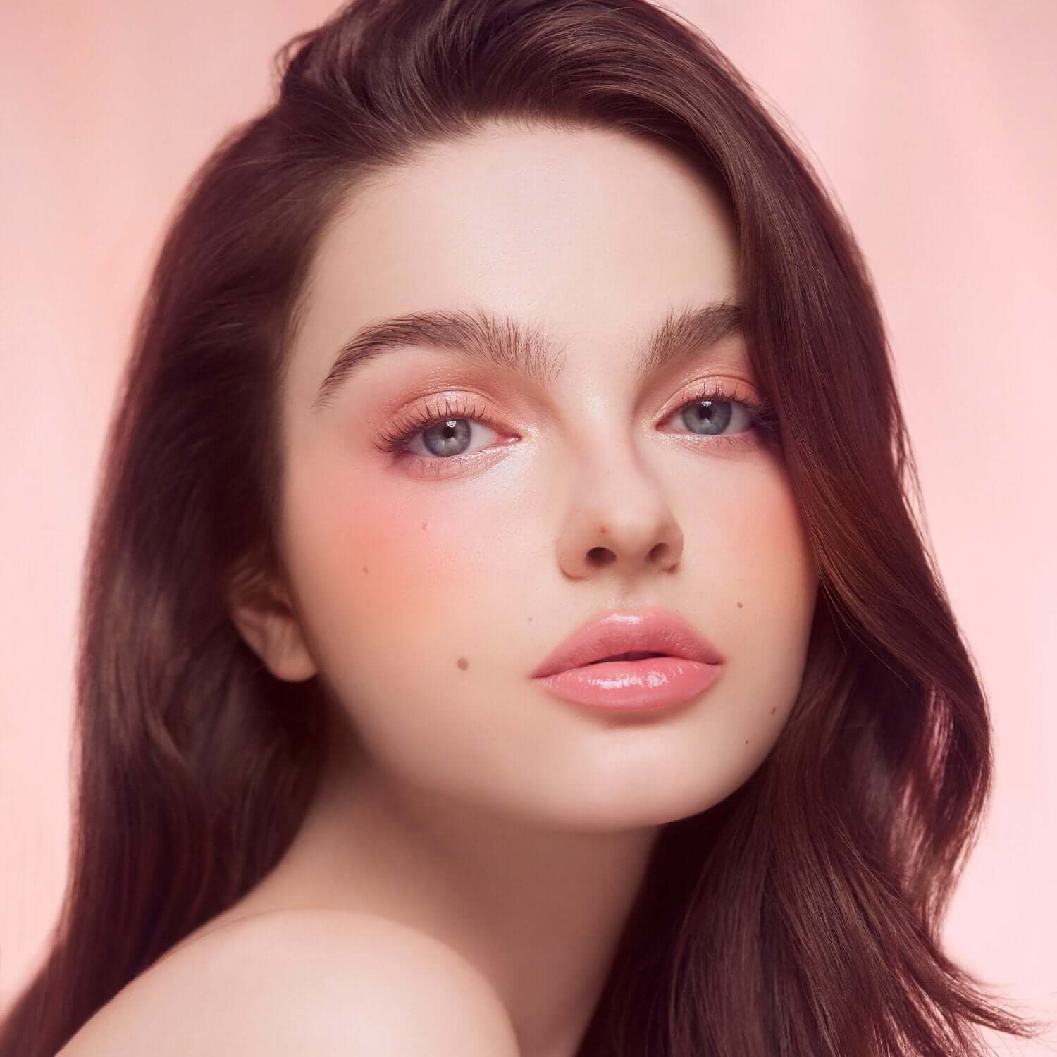 Model wearing DEAR DAHLIA Blooming Edition Paradise Soft Dream Blush with a soft pink makeup look