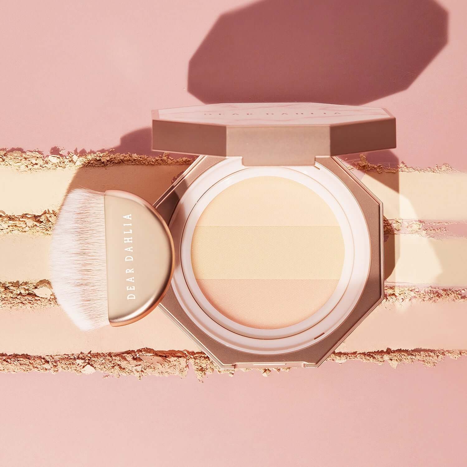 Open DEAR DAHLIA Blooming Edition Sheer Light Finishing Powder with brush, neutral tones, pink background, luxury cosmetic product display.