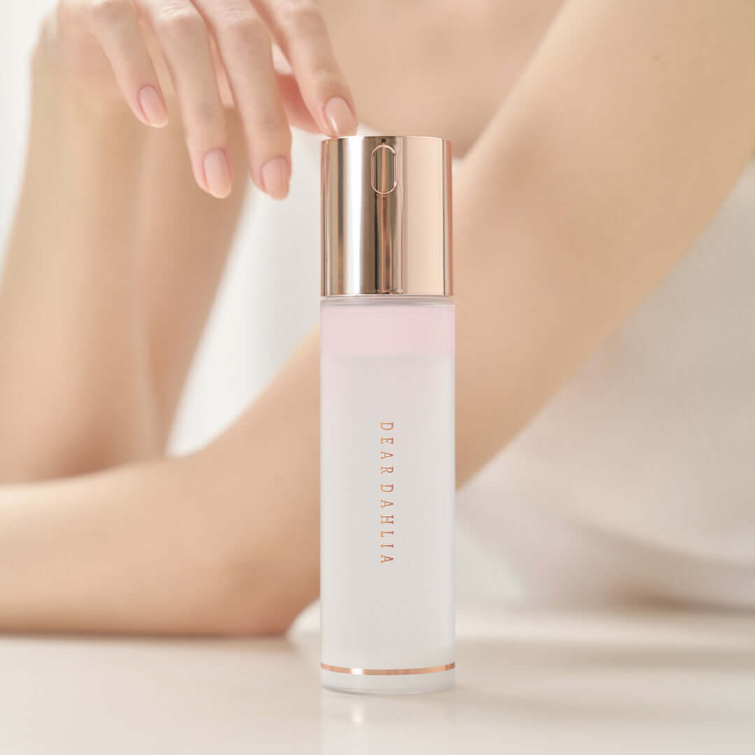 DEAR DAHLIA Endless Skin Cream Mist bottle displayed on a table.