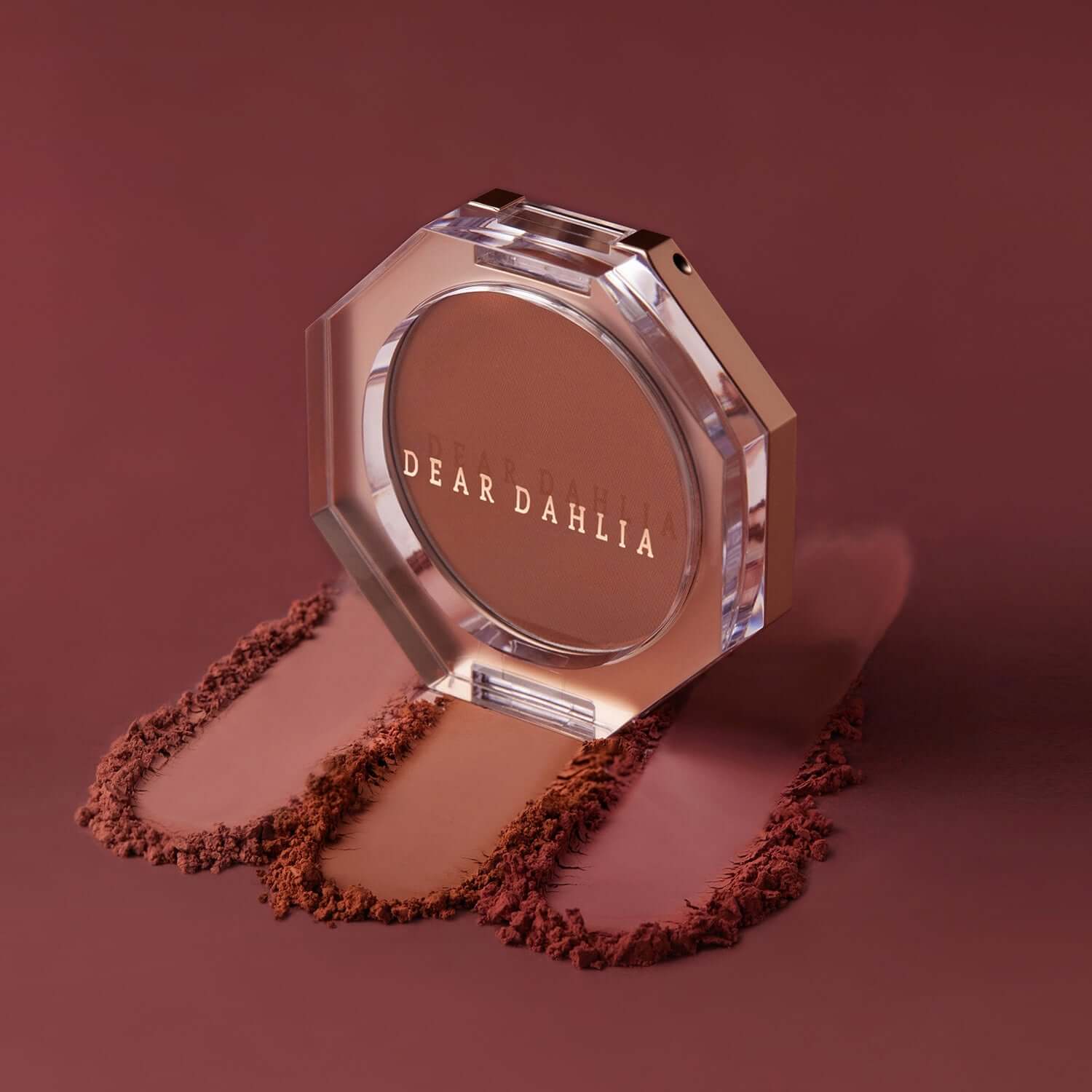 DEAR DAHLIA Paradise Petal Matte Blush in elegant octagonal case with blush accents on a smooth surface, editorial style image.