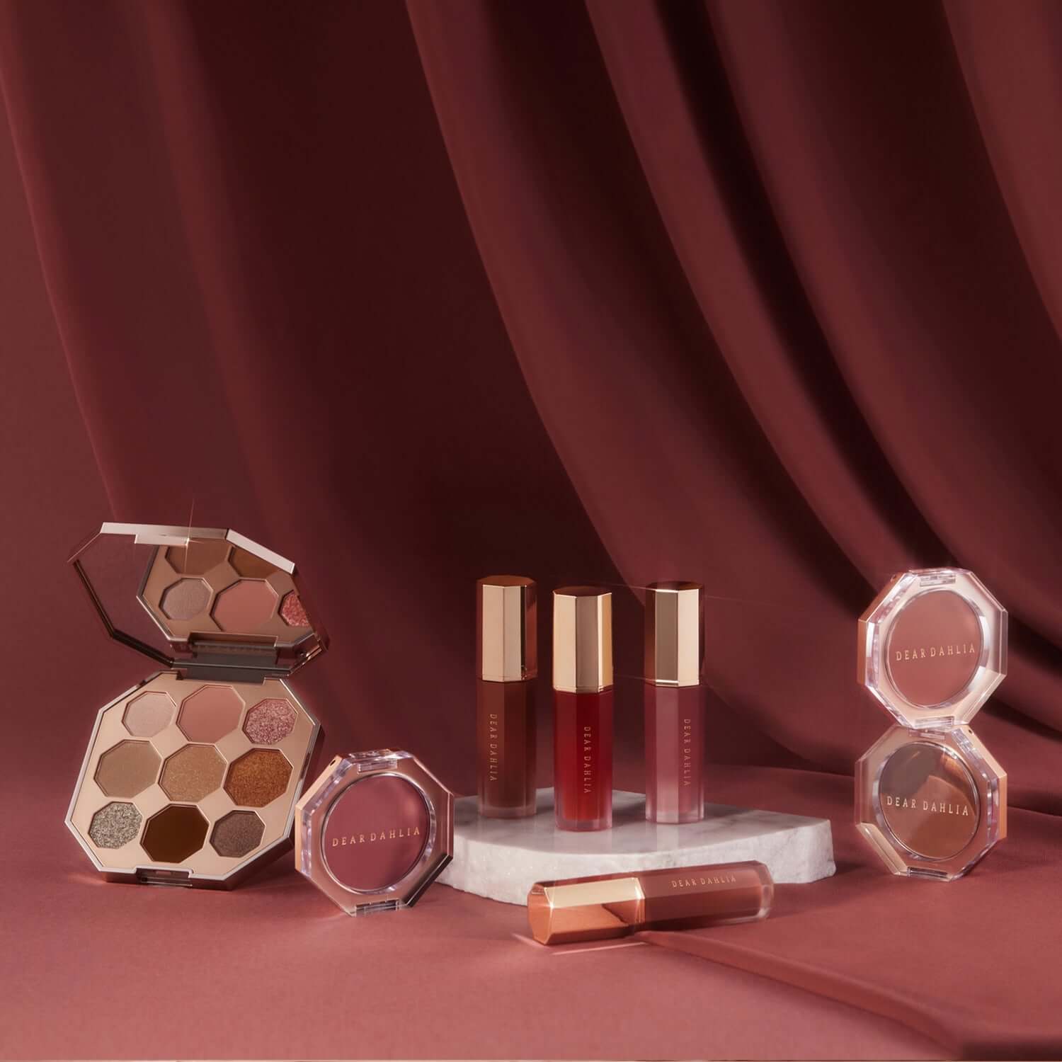 DEAR DAHLIA Paradise Petal Matte Blush collection with lip products and eyeshadow on elegant background.