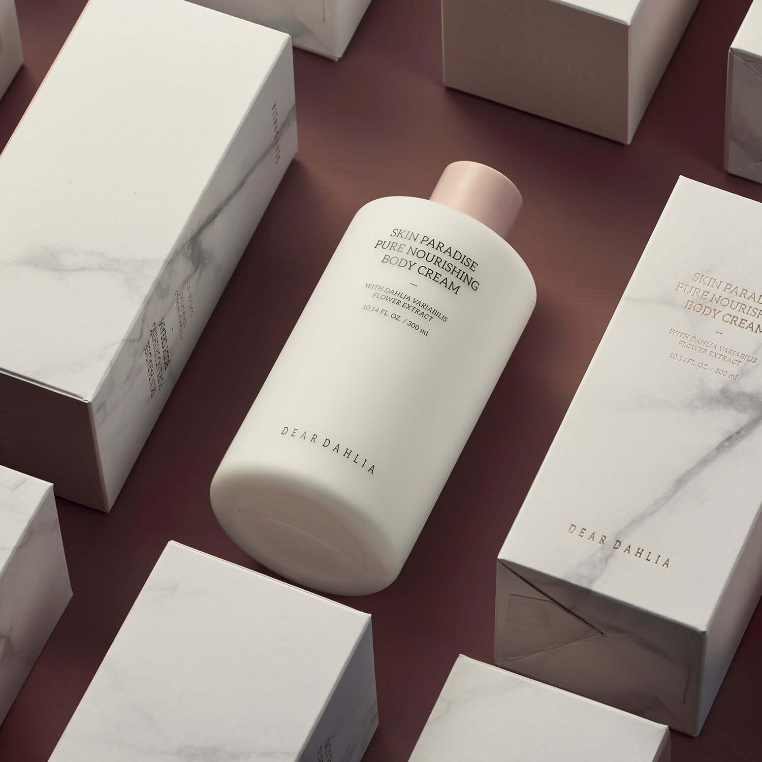 DEAR DAHLIA Skin Paradise Pure Nourishing Body Cream packaging and bottle displayed on a surface.