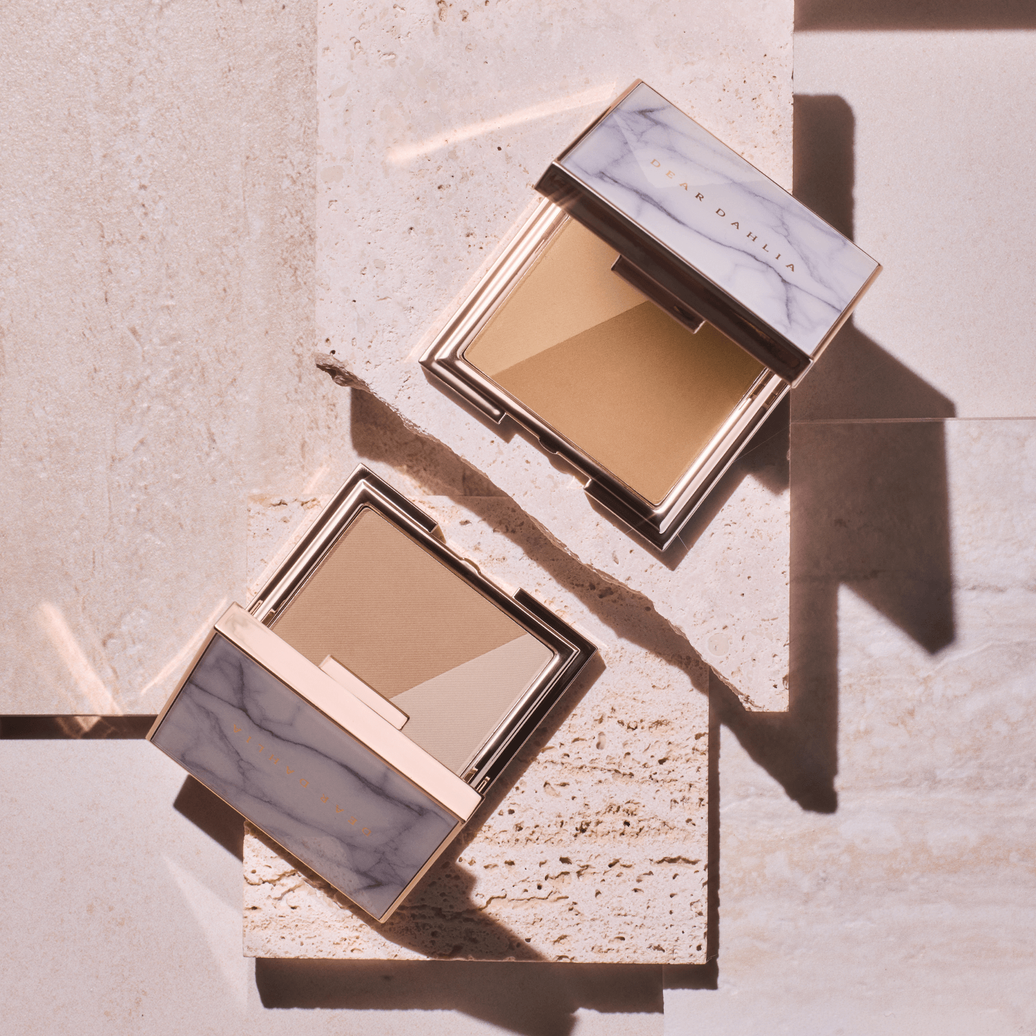 DEAR DAHLIA Skin Silhouette Contour Dou in elegant packaging on a stone surface, showcasing the product design and color tones.
