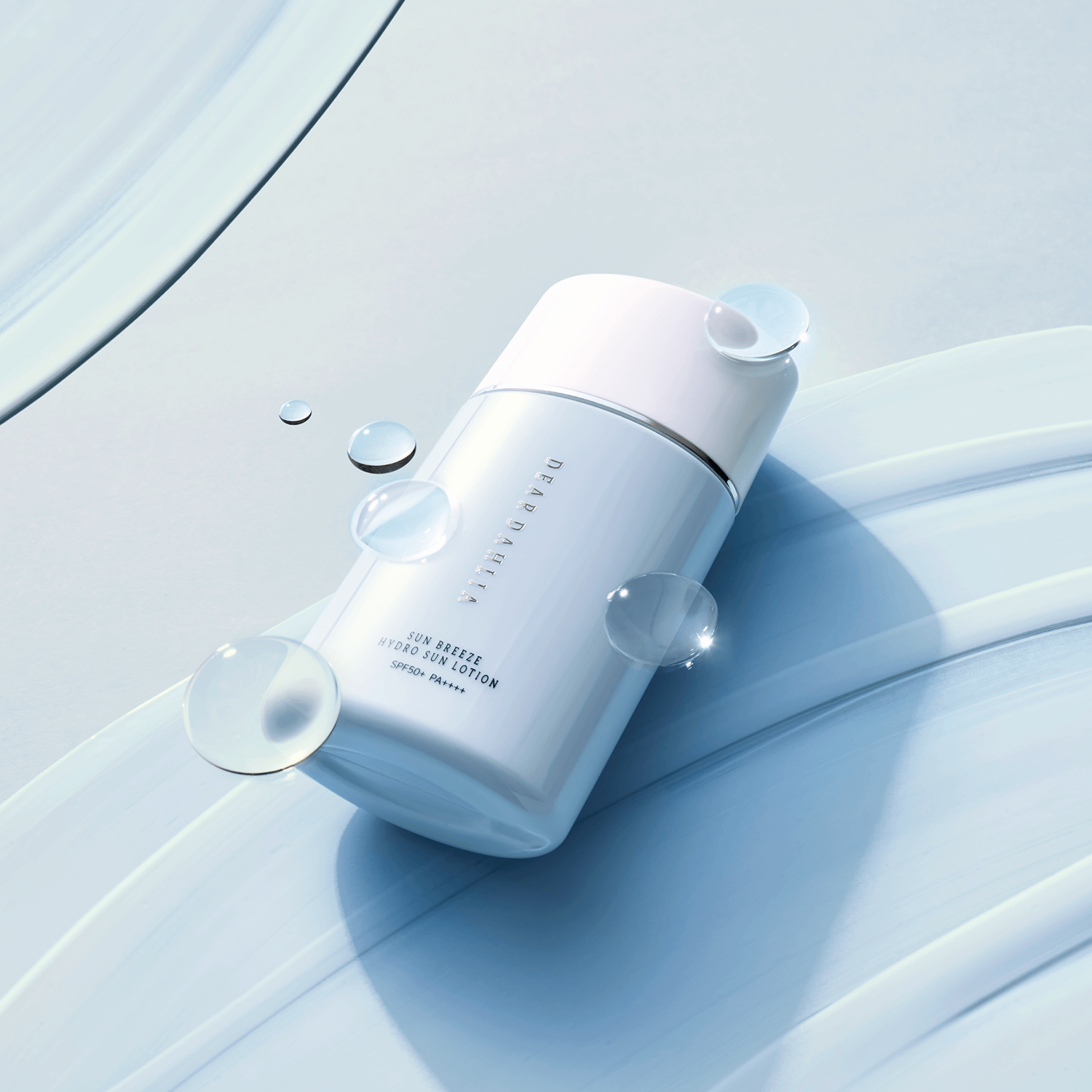 DEAR DAHLIA Sun Breeze Hydro Sun Lotion on smooth blue background with water droplets