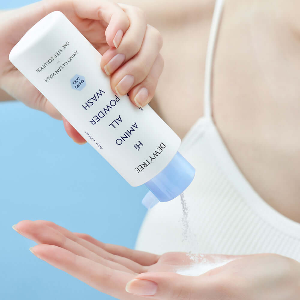 Person pouring DEWYTREE Hi Amino All Enzyme Powder Wash 50g into hand for skincare routine