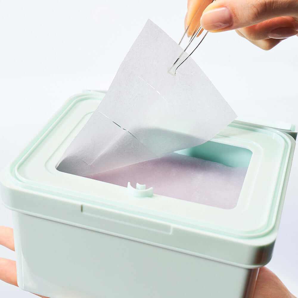 DEWYTREE Pick & Quick Collagen Pore Elasticity Tear-Off Double Pad 100 sheets in use, showing pad being removed from container.