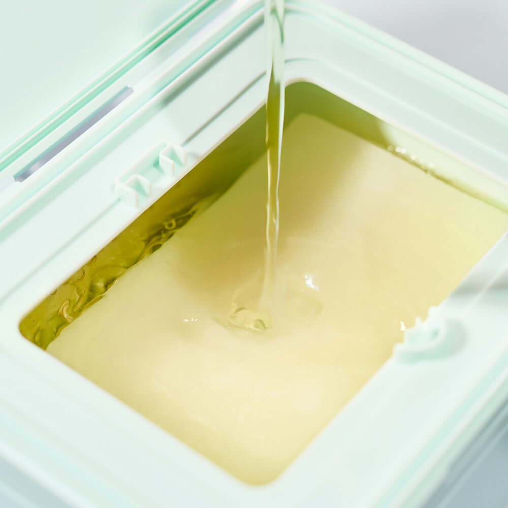 DEWYTREE Pick & Quik Vitamin Glow Tear-Off Double Pads 100 sheets - close-up of pads being soaked with vitamin serum