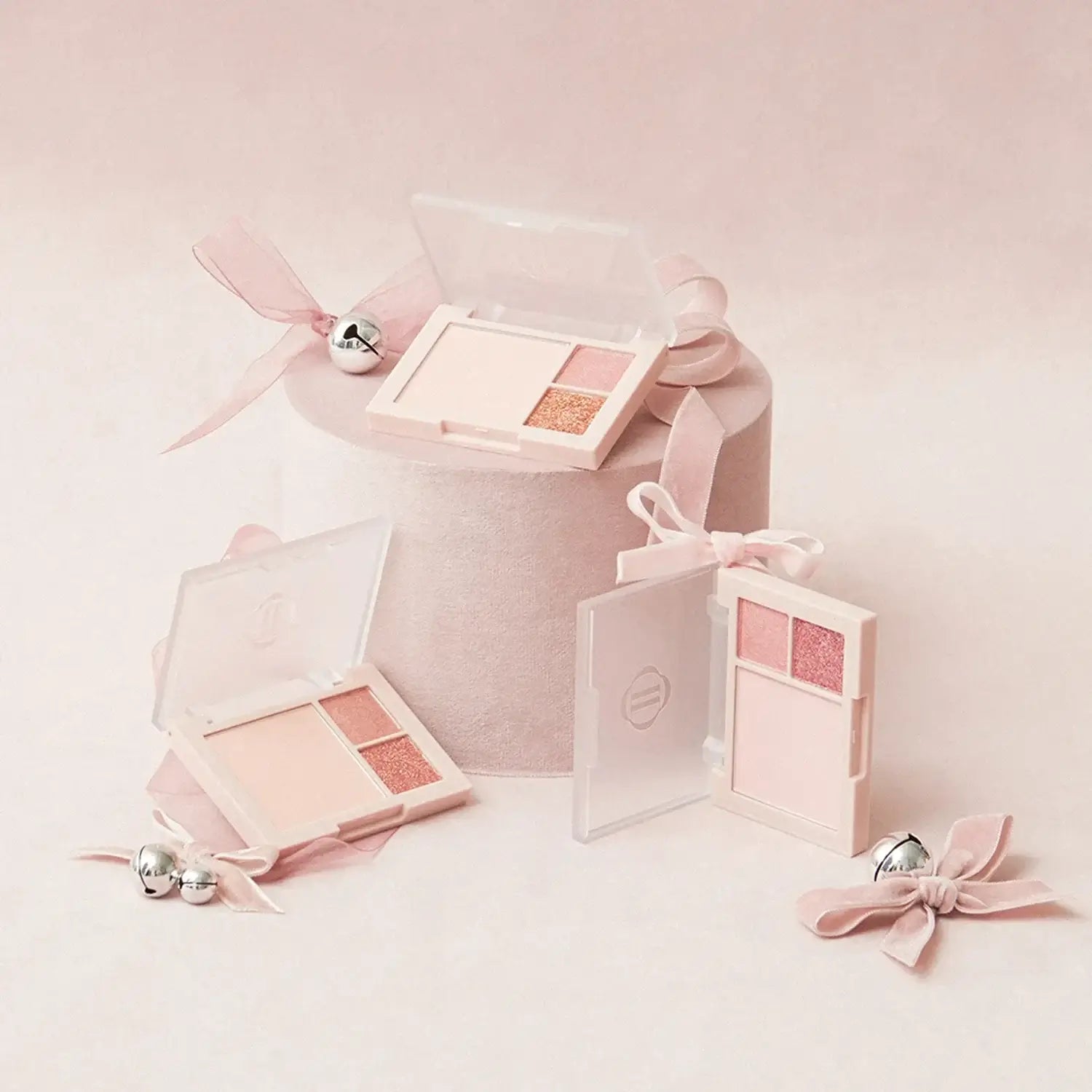 DINTO Cheek & Eye Multi-Use Palette in pink hues with ribbon decor