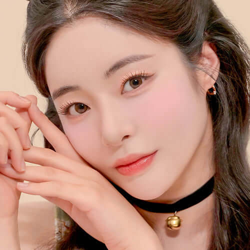 Model showcasing makeup look using DINTO Cheek & Eye Multi-Use Palette highlighting eyes and cheeks.