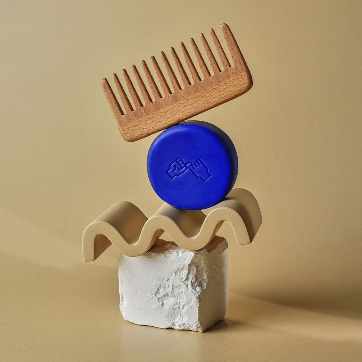 Wooden comb and DONGGUBAT Correct Shampoo Bar Cooling elegantly arranged on natural stone