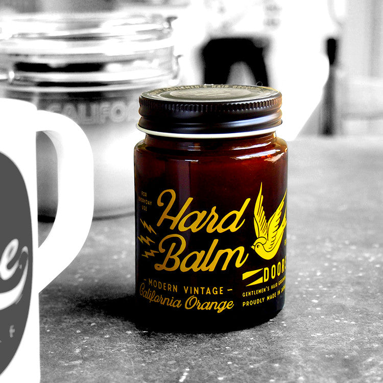 DOORS California Beach Orange Hard Bomb 80g grooming balm jar on countertop – Gentleman Korea men’s skincare product