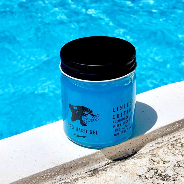 DOORS Hard Gel LTD 200g in blue jar by Gentleman Korea, men’s styling pro hard gel product placed poolside