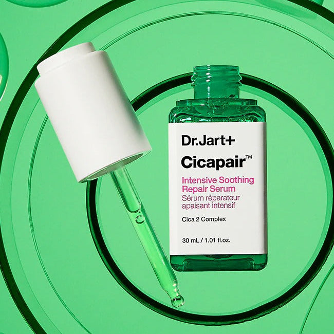 DR.JART+ CicapairI ntensive Soothing Repair Serum 30ml on a green background.