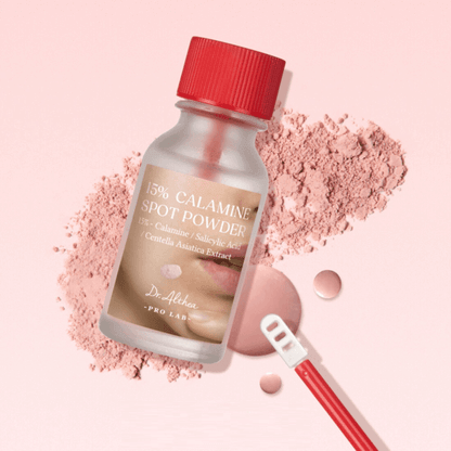 DR.ALTHEA 15% Calamine Spot Powder 15ml bottle on pink background with calamine powder and skincare applicator.