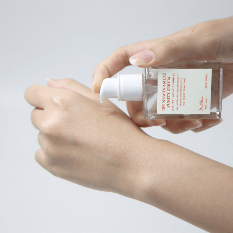 Applying DR.ALTHEA 15% Niacinamide Purity Serum 30ml onto skin for enhanced radiance and hydration