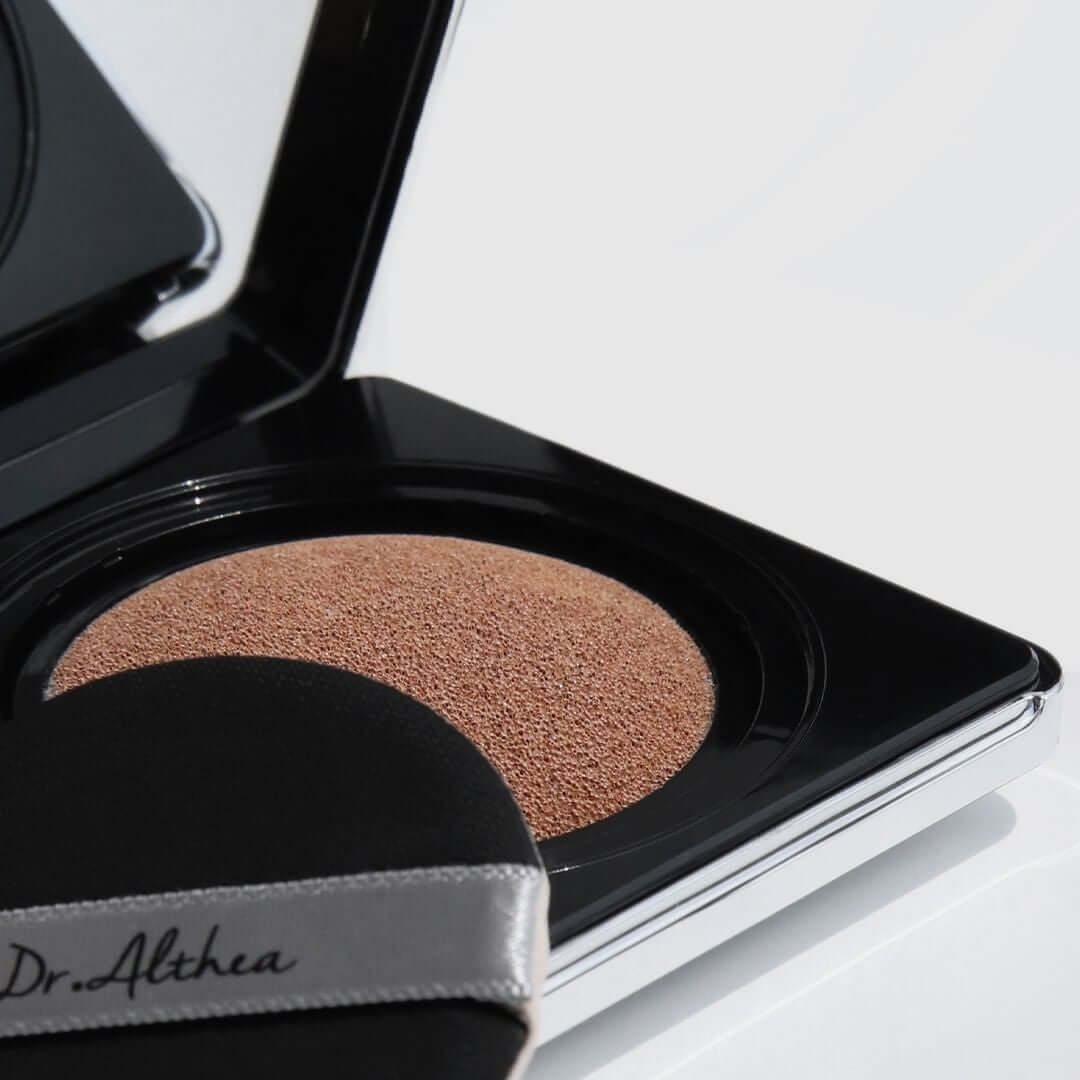 Close-up of DR.ALTHEA Aurora Cover Cushion 15g showing cushion texture and puff applicator in compact.