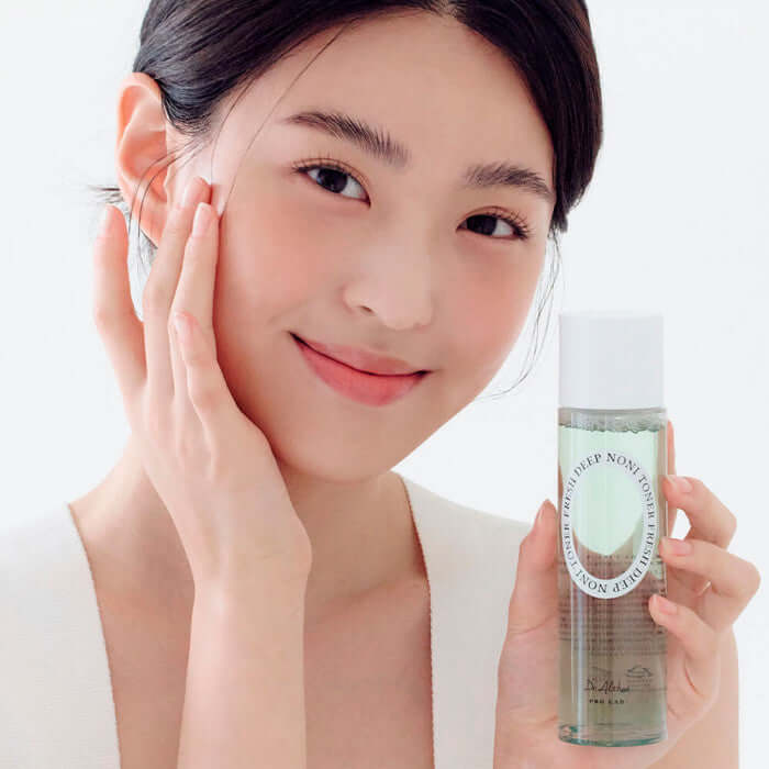 Woman holding DR.ALTHEA Fresh Deep Noni Toner 130ml bottle