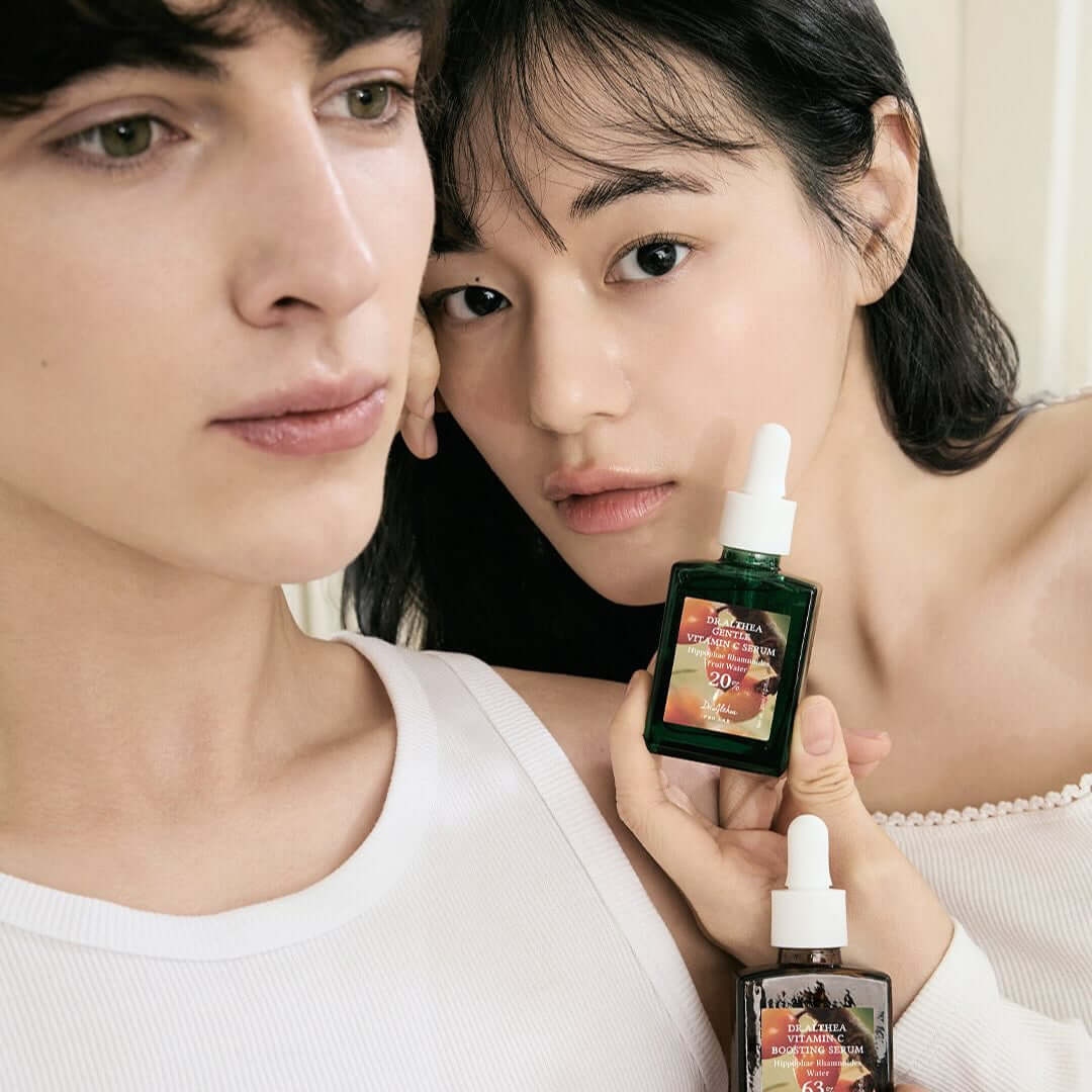 Models holding DR.ALTHEA Gentle Vitamin Serum 30ml bottle, showcasing skincare benefits.