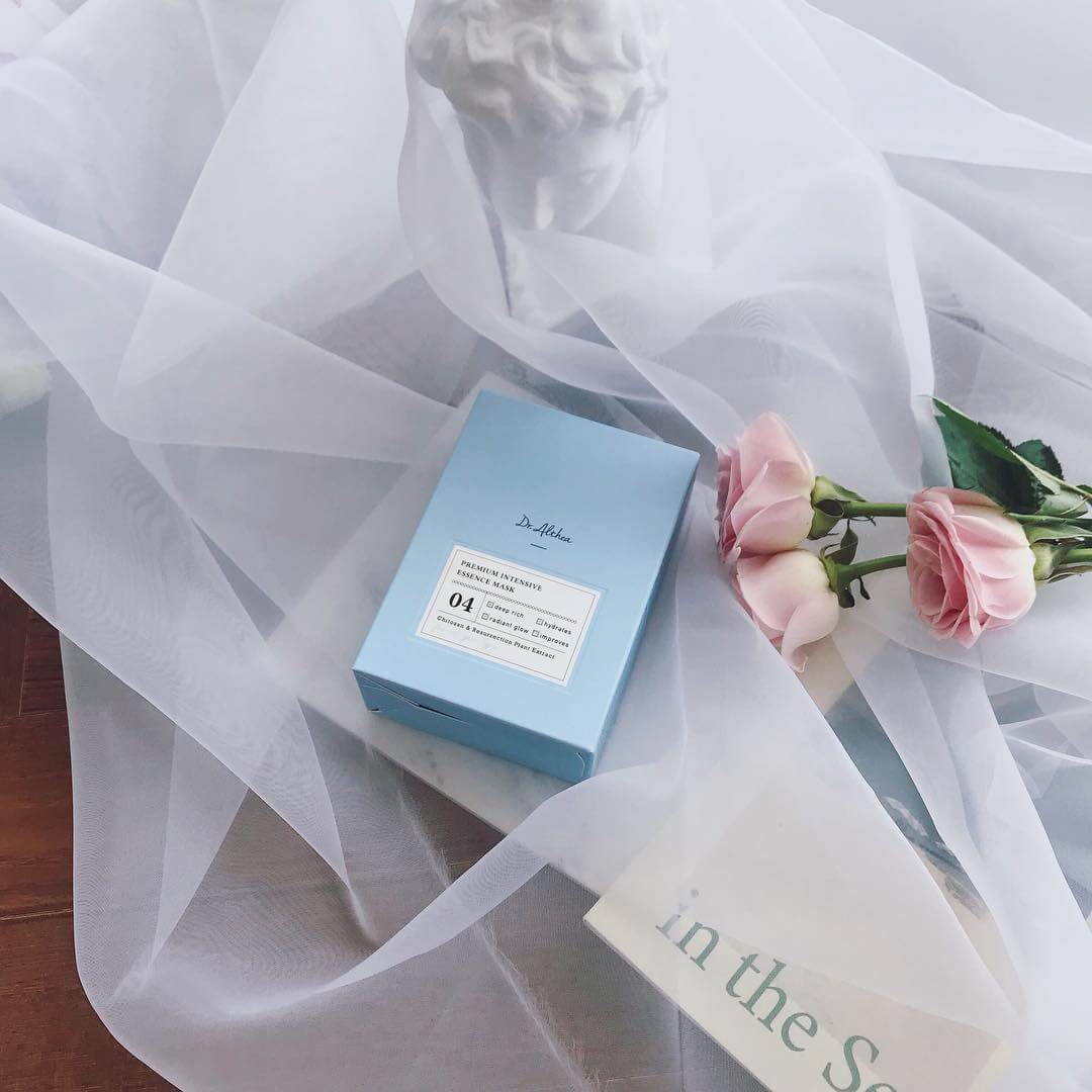 DR.ALTHEA Premium Intensive Essence Mask displayed with pink roses and elegant decor