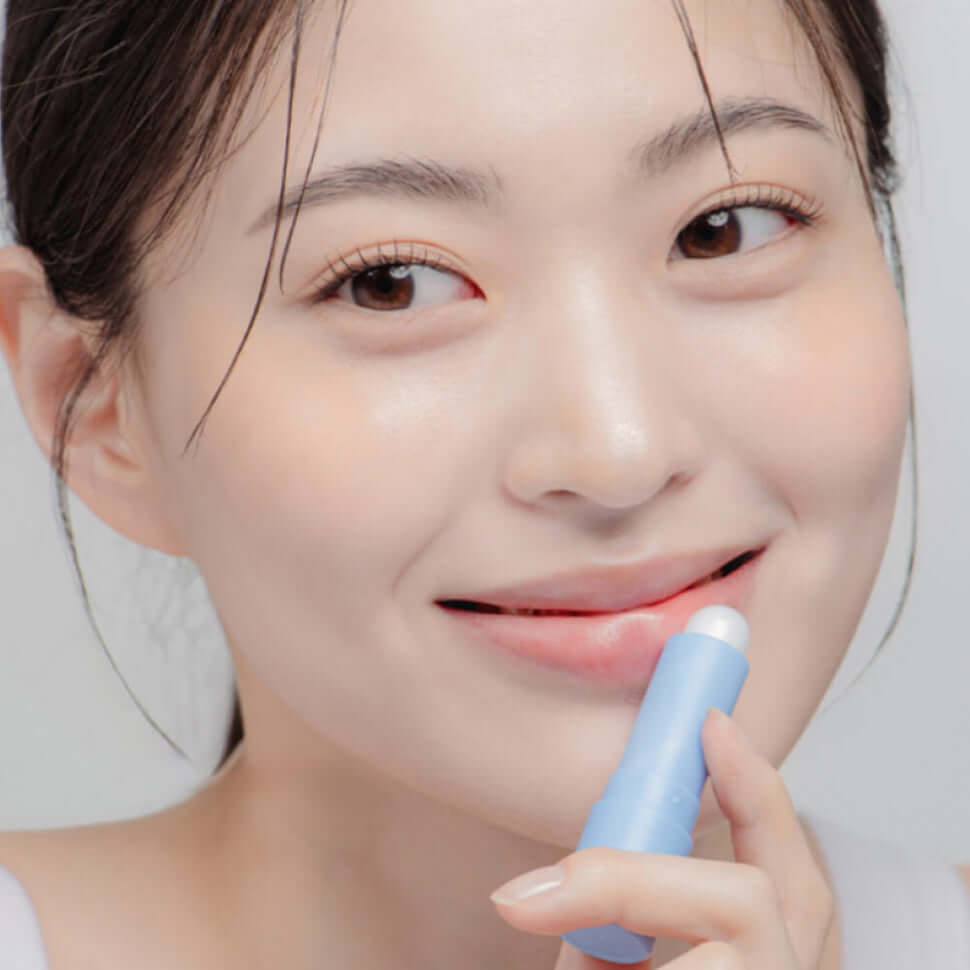 Woman applying DR.ALTHEA Soft Malting Lip Balm for smooth lips