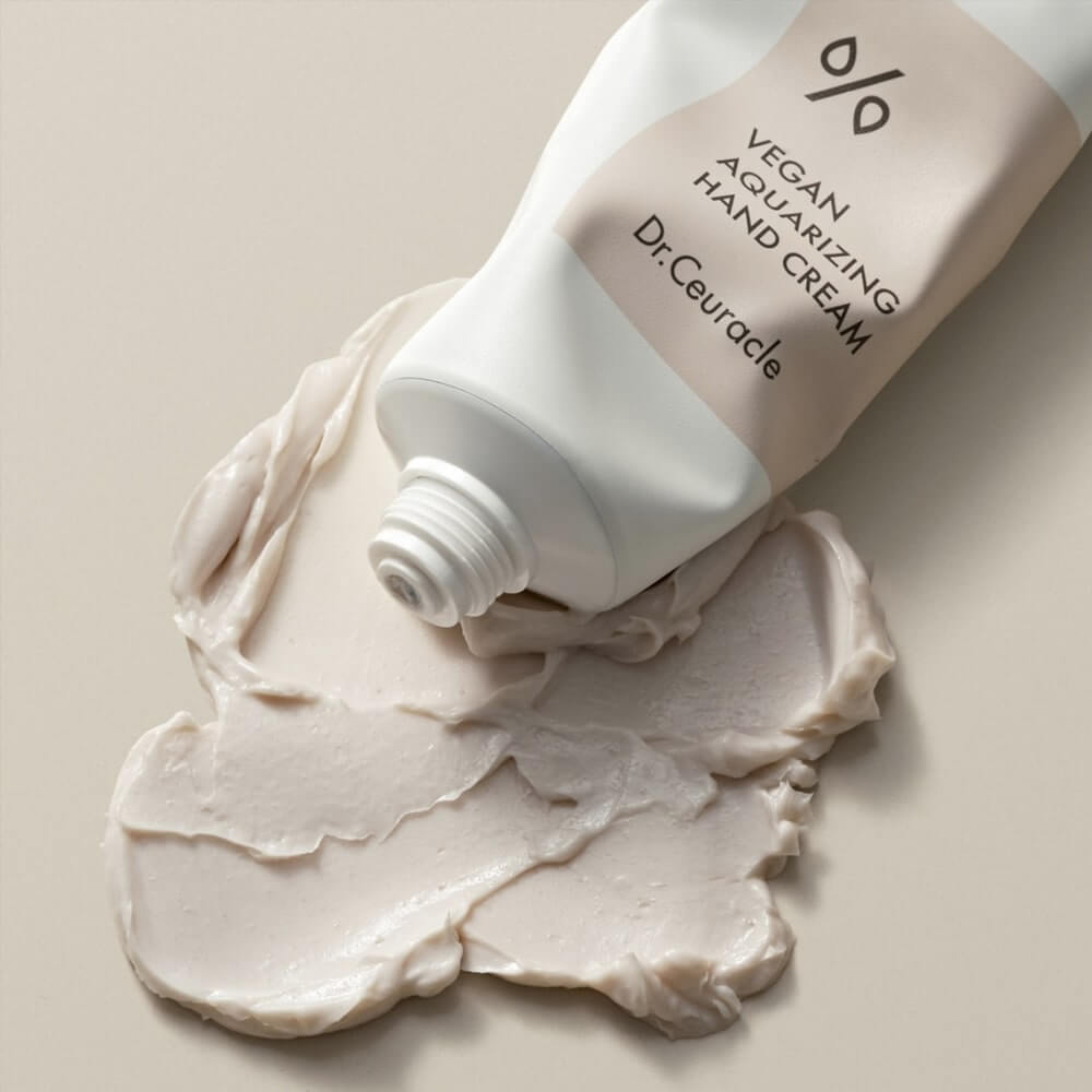 DR.CEURACLE Aqua Rising Hand cream 50ml tube with cream swatch on a neutral background.
