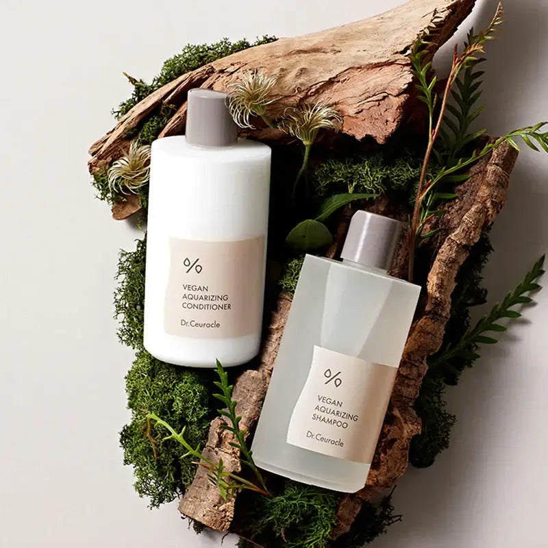 DR.CEURACLE Aqua Rising Shampoo 300ml displayed with vegan conditioner on natural backdrop