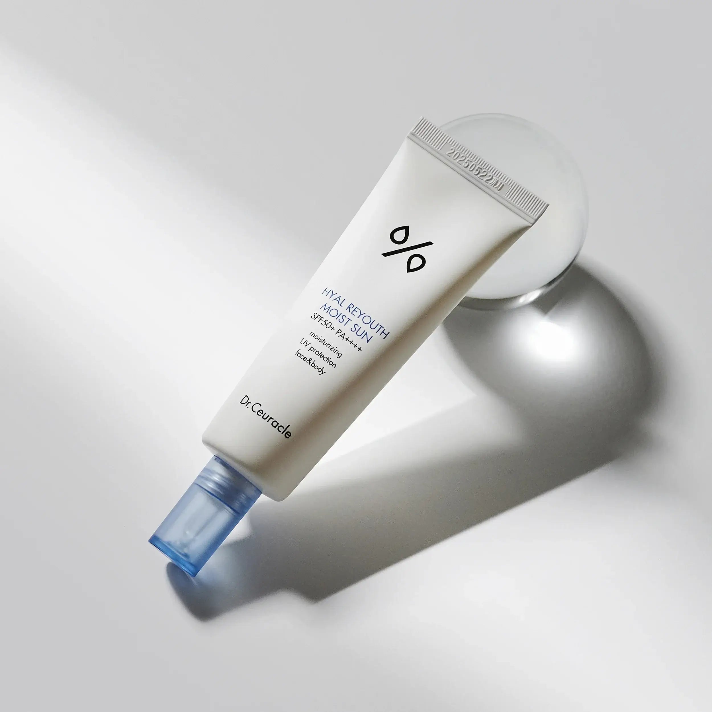 DR.CEURACLE Hyal Reyutsu Moist Sun SPF50+,PA++++ sunscreen tube on light background
