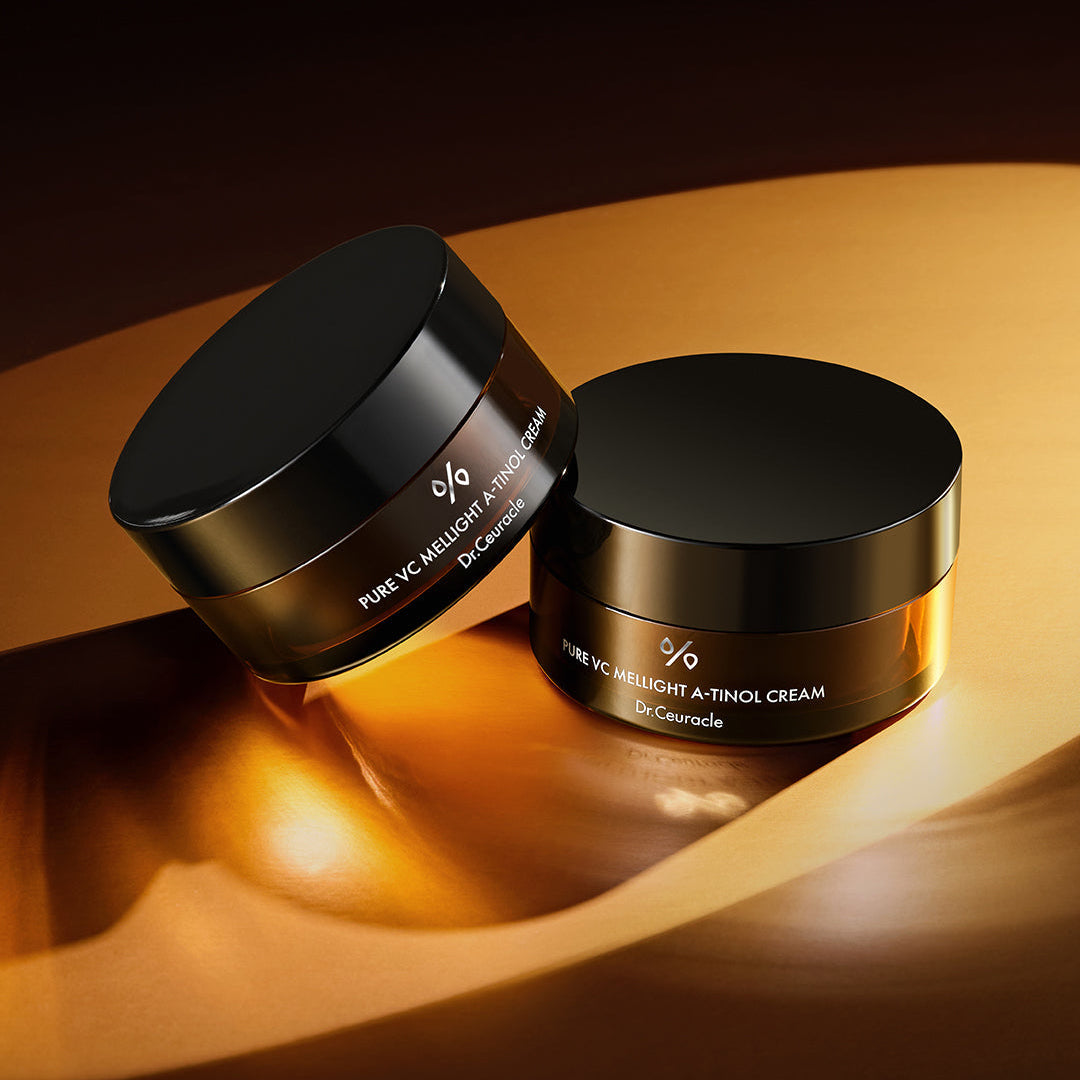 DR.CEURACLE Pure VC Mellight A-Tinol Cream 70g displayed with elegant packaging on a golden surface.