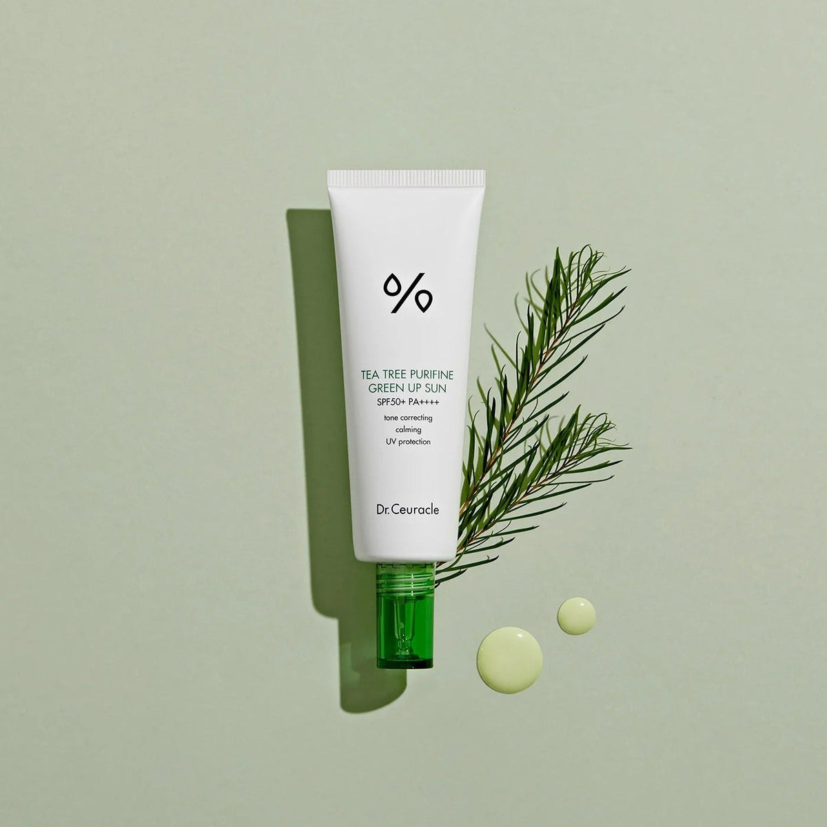 DR.CEURACLE Tea Tree Purifine Green Sup Sun 50ml with greenery backdrop
