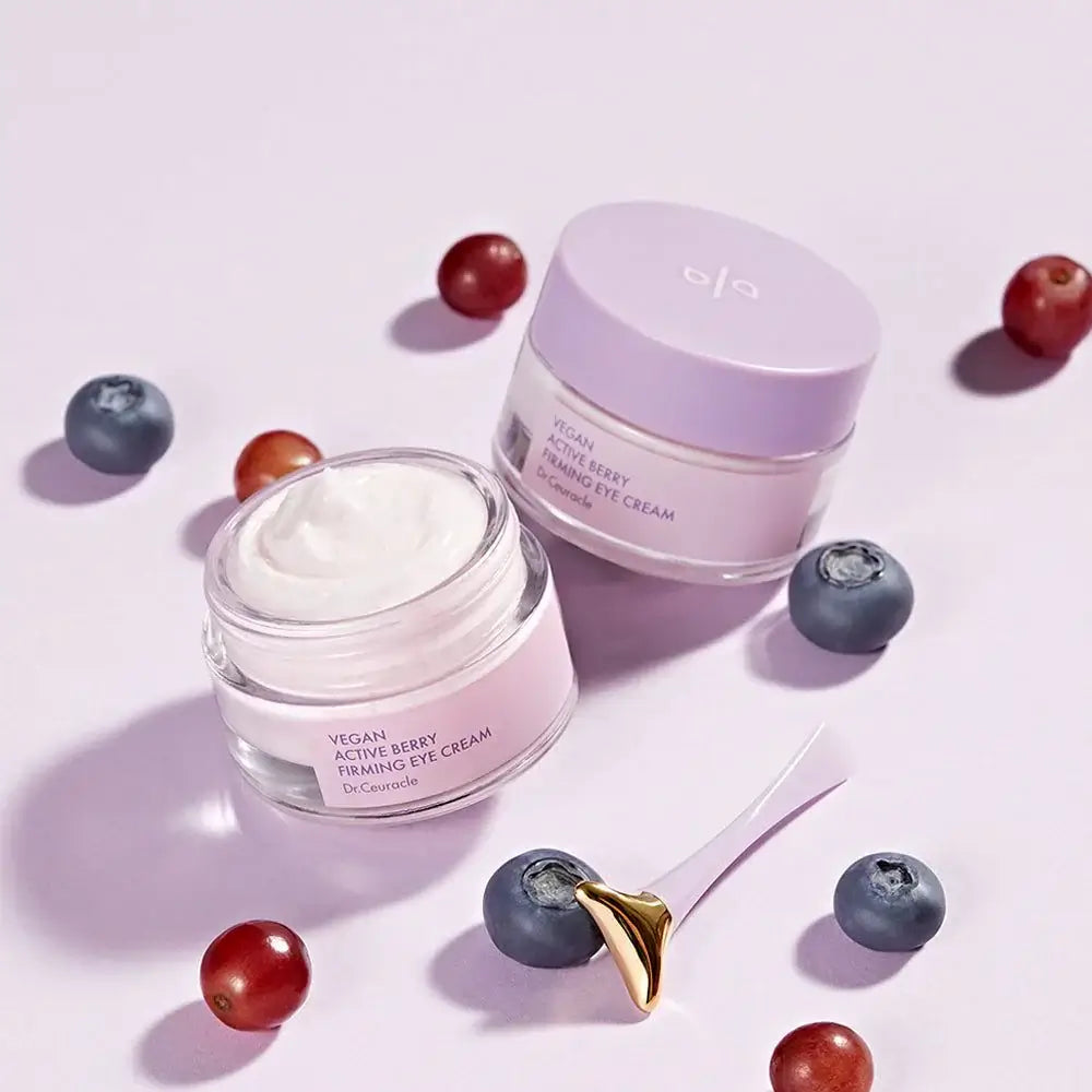 DR.CEURACLE Vegan Active Berry Firming Eye Cream with open jar and berries, featuring anti-aging skincare formula.