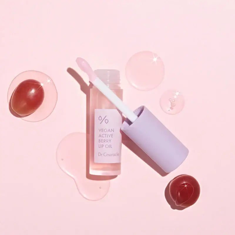 DR.CEURACLE Vegan Active Berry Lip Oil displayed with pink background and glossy texture