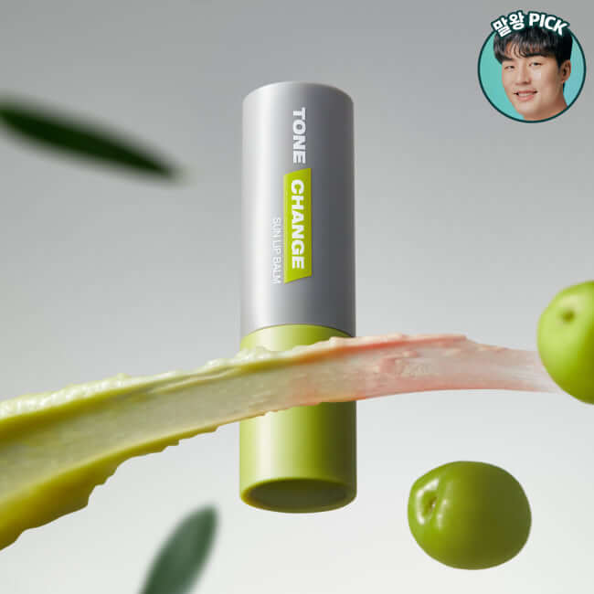 DR.G For Men Tone Change Sun Lip Balm surrounded by green olives and aloe vera, emphasizing sun protection and tone correction.