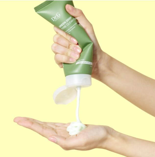 Person using DR.G Green Deep Pore Clear Foam on hand for skincare routine.