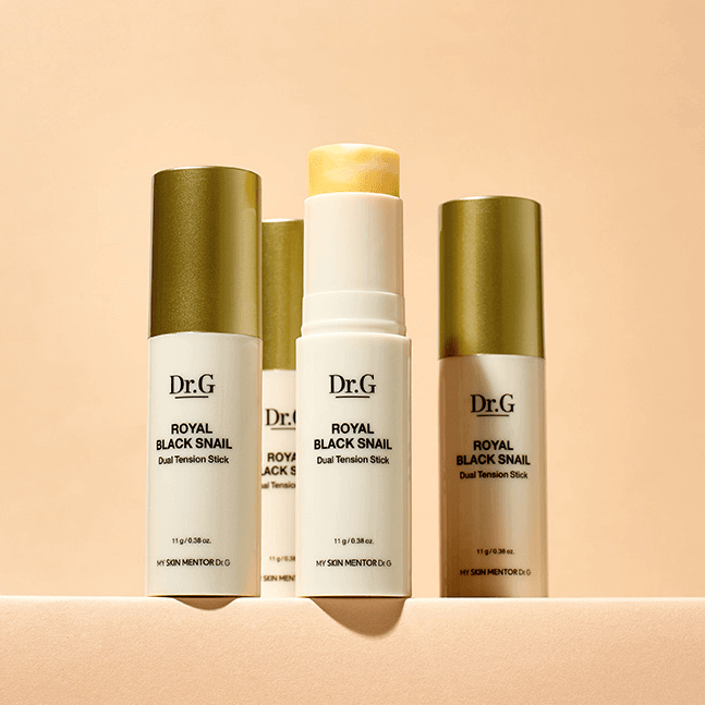 DR.G Royal Black Snail Dual Elastic Stick skincare product displayed with cap off and visible texture against a peach background.