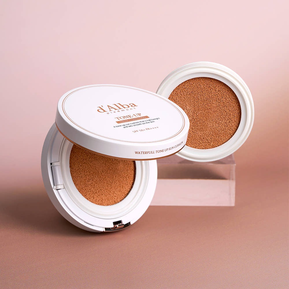 D'ALBA Vegan Tone-up Sun Cushion 15g 1 main product + 1 refill, showing cushion and refill on a pink background