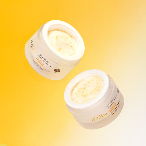 D'ALBA Vita Toning Capsule Cream Complex 55g in two open jars on a gradient orange background