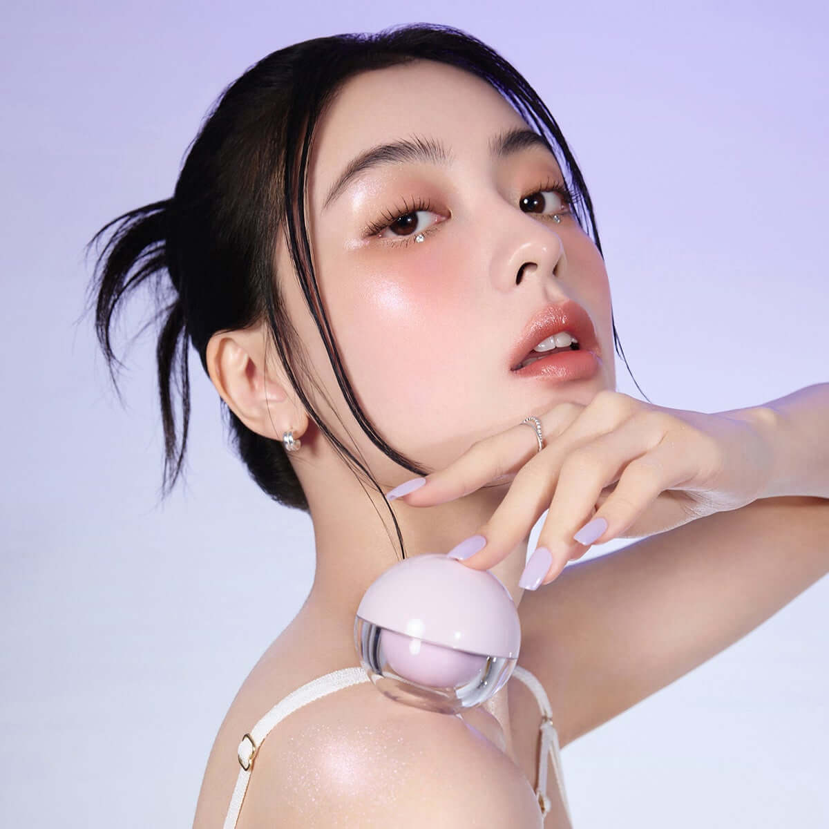 Model showcasing ESPOIR DEWLIKE JELLO POT makeup product with soft lighting and elegant pose.