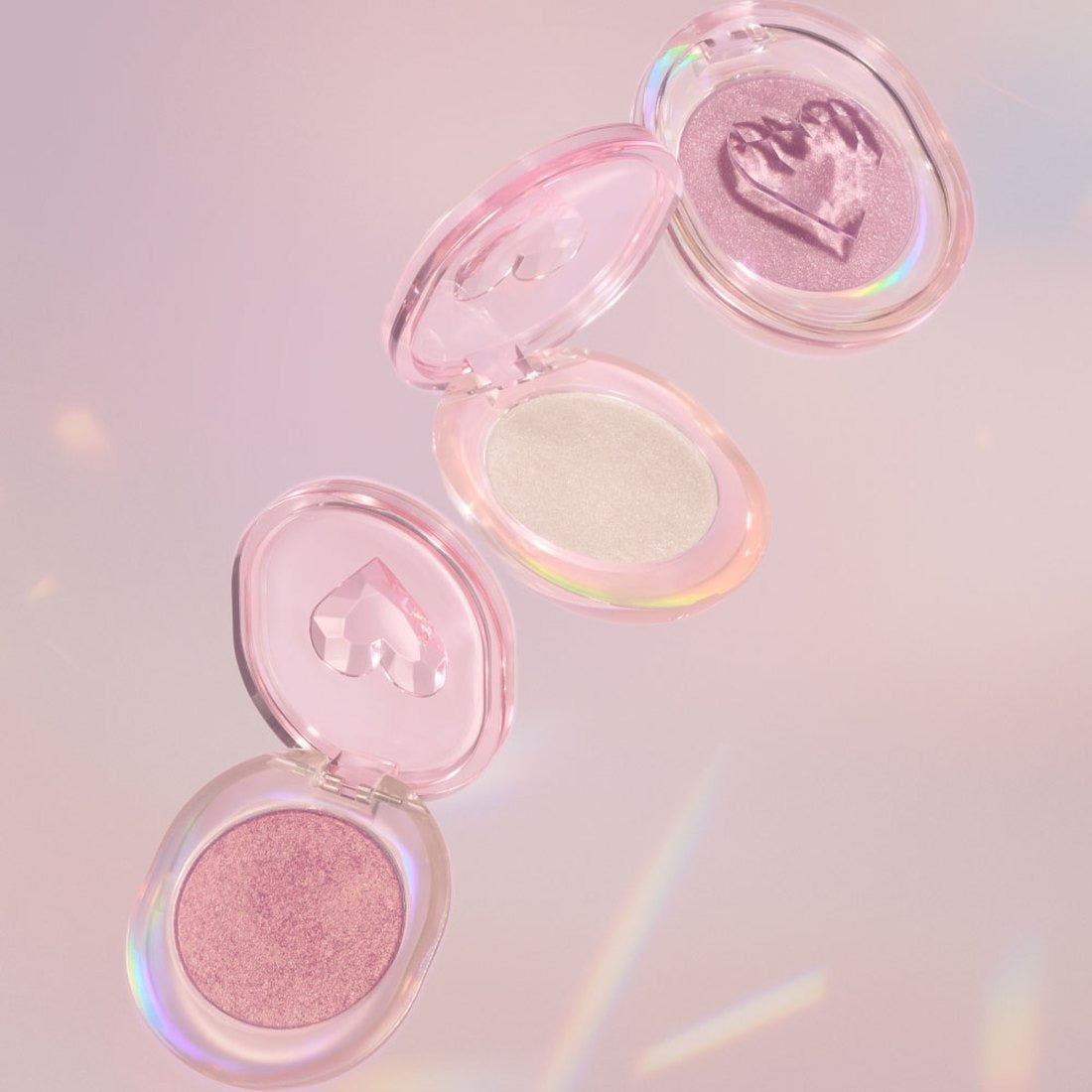 ETUDE Shooting Beam Highlighter 3g in open cases showcasing shimmer shades