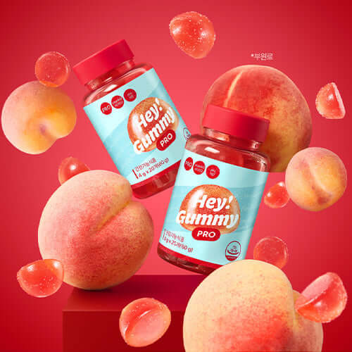FOODOLOGY Hey! Gumi Pro 80g peach-flavored gummy vitamins with vibrant red and coral packaging, surrounded by peaches and gummy pieces.