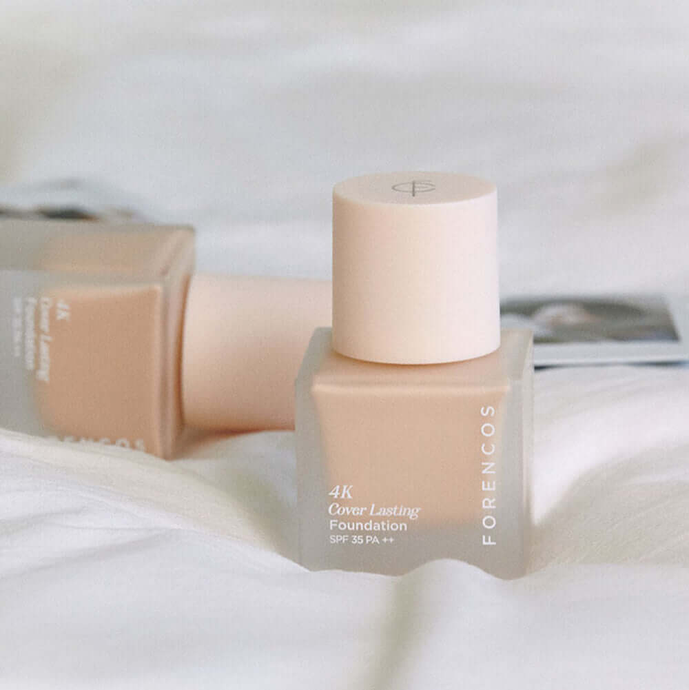 FORENCOS 4K Cover Lasting Foundation 30ml on a white background showcasing elegant packaging design.