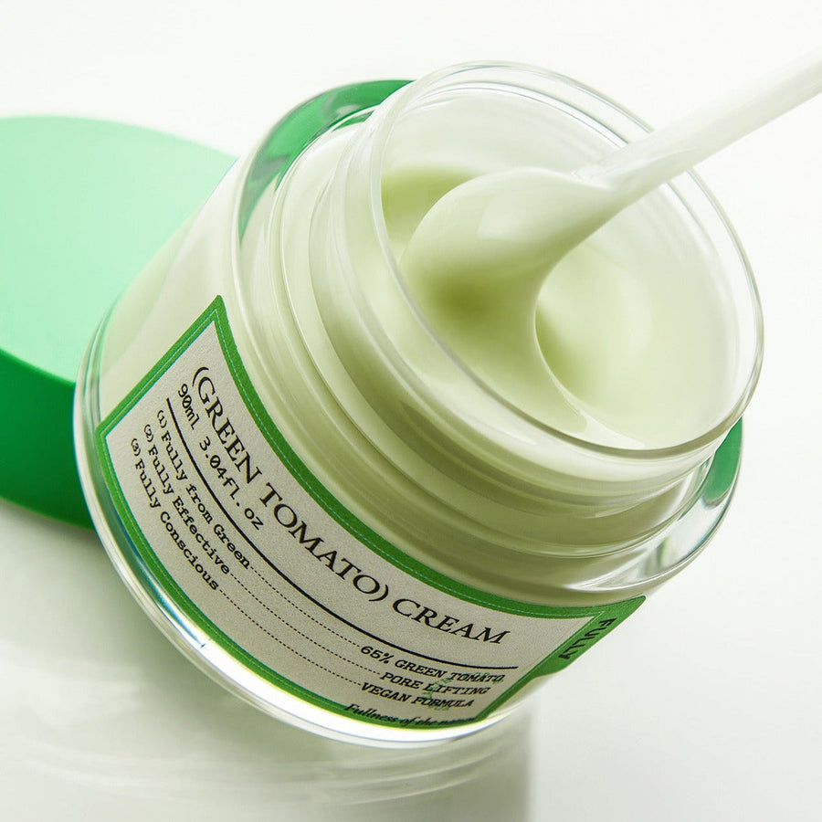 Open jar of FULLY Green Tomato Cream 90ml with a close-up of the smooth green cream and product label.