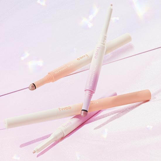 FWEE Dual Aego Sal Full-Filler makeup pens on a pink background, showcasing beauty products.