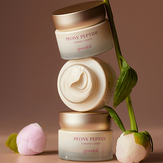 Three jars of GOODAL Peony Peptide Volume Cream 60ml stacked with peony flowers in a stylish skincare composition.