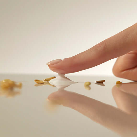 Applying GOODAL Vegan Rice Milk Moisturizing Cream 70ml with rice exfoliant particles on skin surface.