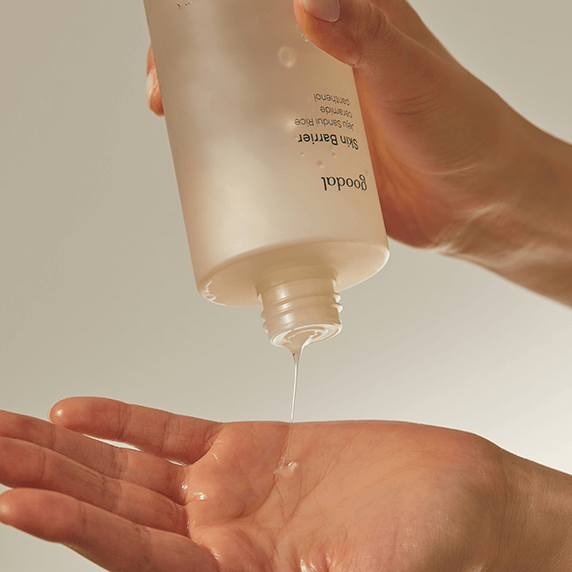 Person pouring GOODAL Vegan Rice Milk Moisturizing Toner 250ml into hand