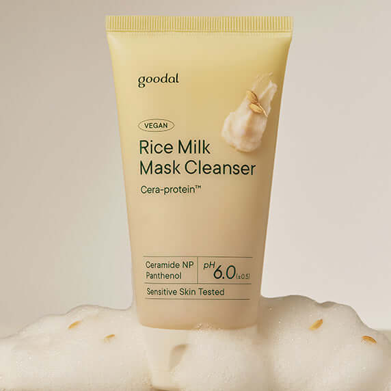 GOODAL Vegan Rice Milk Pack Cleanser tube surrounded by foam, showcasing the product's packaging and emphasizing its vegan formula.