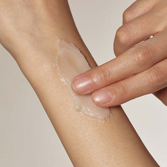 Applying GOODAL Vegan Rice Milk Pack Cleanser on arm for nourishment and hydration
