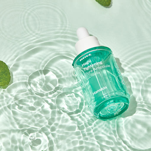 HANSKIN Magic Tightening Pore Ampoule 30ml on a watery background