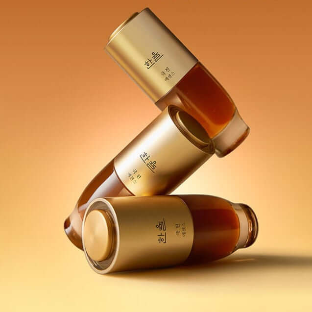 HANYUL Extreme Essence Planning Set bottles stacked against gradient background.